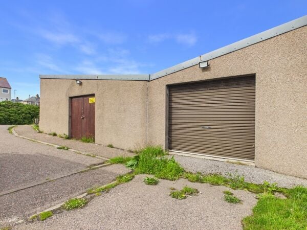 Fire‑damaged joiners workshop with strong coastal redevelopment potential