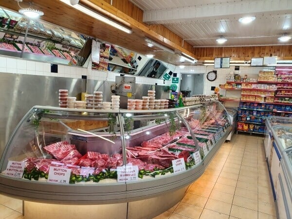 Well maintained Halal butchers and grocery shop in a very good area with free car park for customers. Photo 1