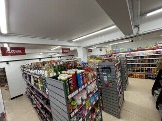 Off license, international foods, halal butchers. Photo 5