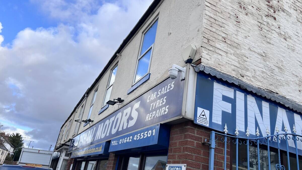 Established Car sales and repair dealership with flats.With planning permission to build on