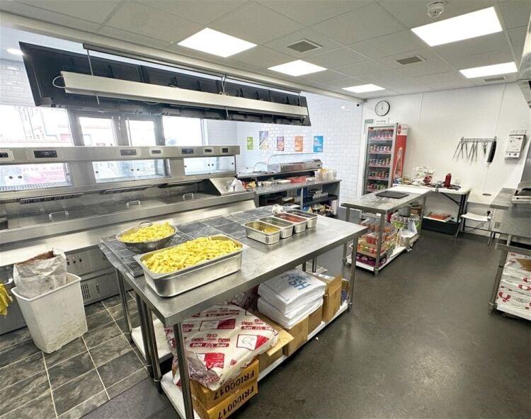 Modern fish & chip takeaway, end-of-parade Upton