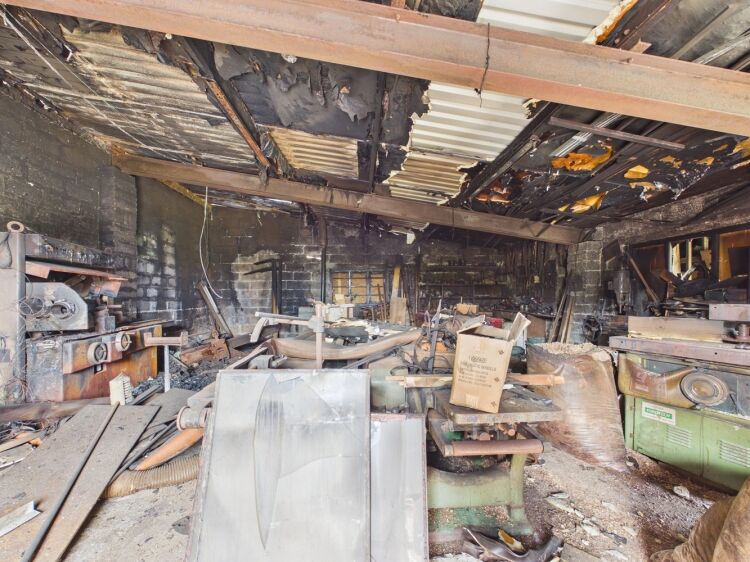 Fire‑damaged joiners workshop with strong coastal redevelopment potential