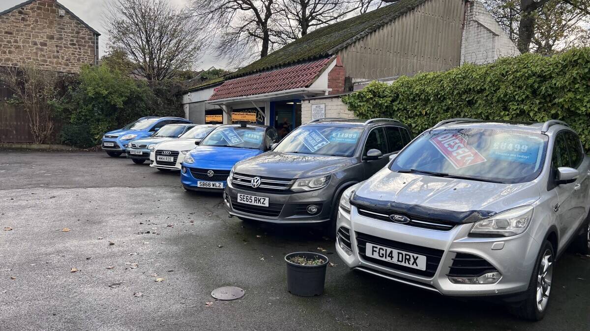 Established Car sales and repair dealership with flats.With planning permission to build on Photo 7