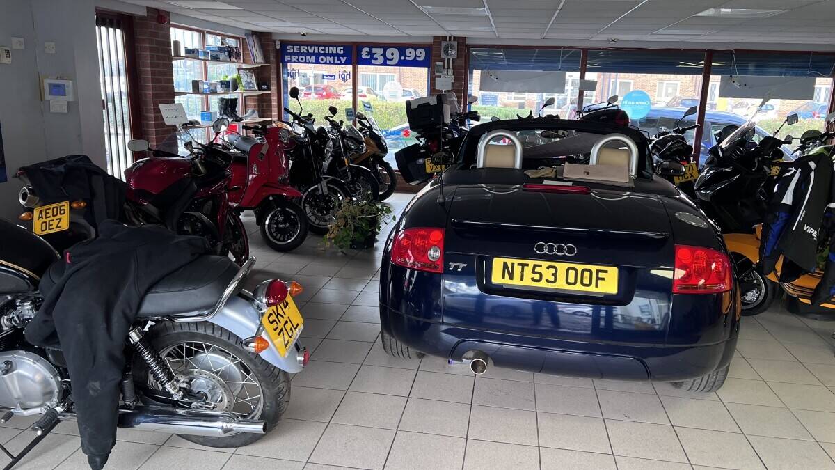 Established Car sales and repair dealership with flats.With planning permission to build on
